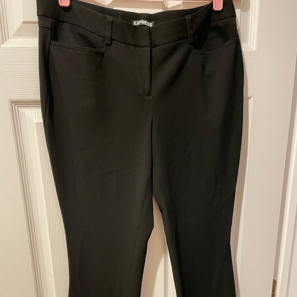 Woman express black dress pants